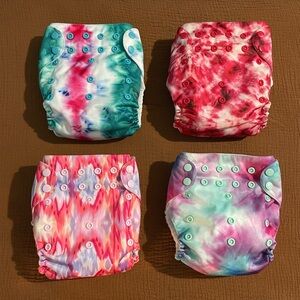 Four Mama Koala Diapers with four inserts. Never worn!